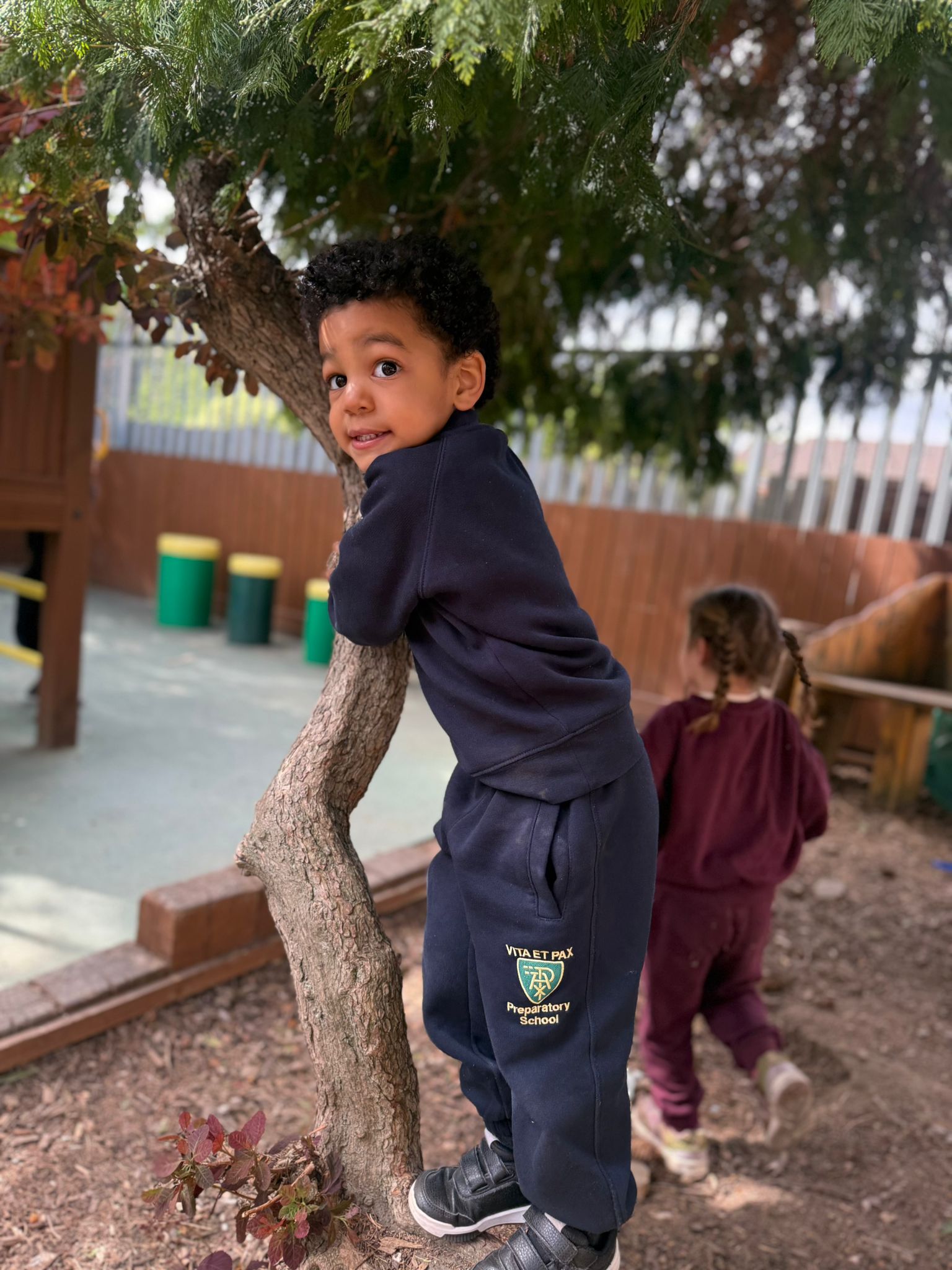 A child at Little Vita’s Nursery exploring the outdoor play garden